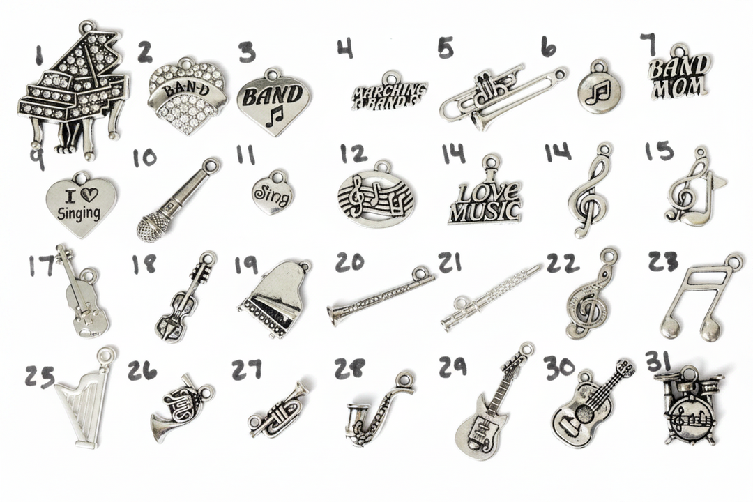 Numbered silver-plated music instrument charm collection for Jules Obsession expandable bangle bracelets including crystal grand piano, crystal BAND fan charm, BAND heart with music note, Marching Bands script charm, trombone, round music note disc, BAND MOM tag, I Love Singing heart, microphone, Sing heart, treble clef and music notes oval, Love Music tag, treble clef charm, treble clef with note, violin, detailed violin, grand piano, flute, conductor baton, treble clef swirl, music note charm, harp, Frenc