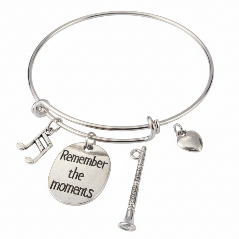 Silver expandable charm bangle bracelet with musical notes charm, engraved Remember the Moments disc, detailed clarinet charm, and heart charm — music gift bracelet for clarinet and oboe players by Jules Obsession