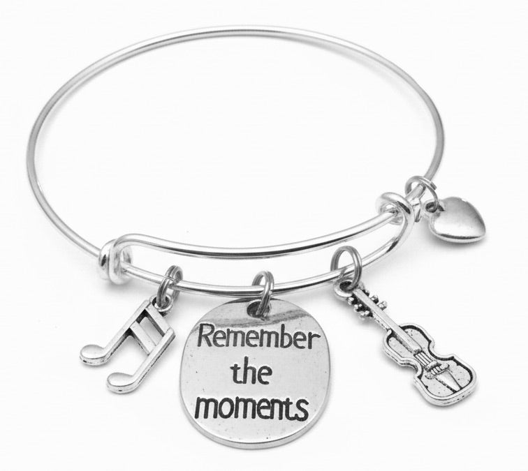 Silver expandable charm bangle bracelet with musical notes charm, engraved Remember the Moments disc, detailed violin charm, and heart charm on wire — orchestra and string music gift bracelet by Jules Obsession