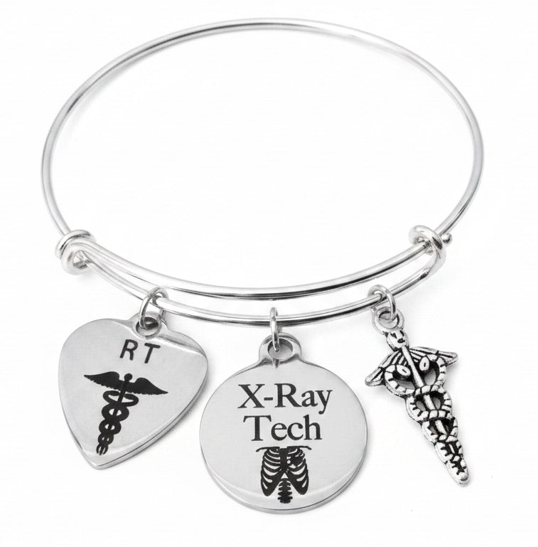 X-Ray Tech RT Radiation Technologist silver expandable bangle bracelet with RT heart caduceus charm, X-Ray Tech engraved ribcage disc charm, and 3D caduceus charm each attached with individual jump rings — radiology jewelry gift by Jules Obsession