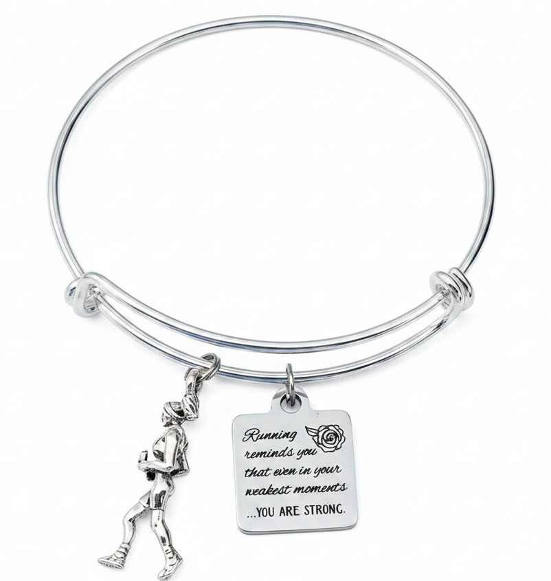 Silver-plated expandable bangle bracelet with 3D silver-plated female runner figurine charm and stainless steel engraved square tag charm reading 'Running reminds you that even in your weakest moments YOU ARE STRONG' — motivational gift for teen and adult runners and athletes