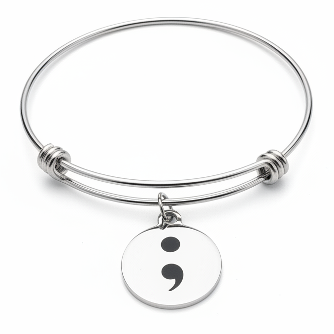 Silver adjustable semicolon charm bangle bracelet on white background — mental health awareness jewelry