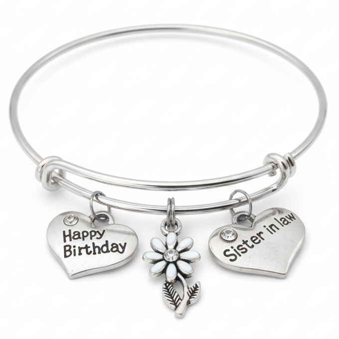 Silver bracelet with 'Happy Birthday' and 'Sister in law' charms on a white background