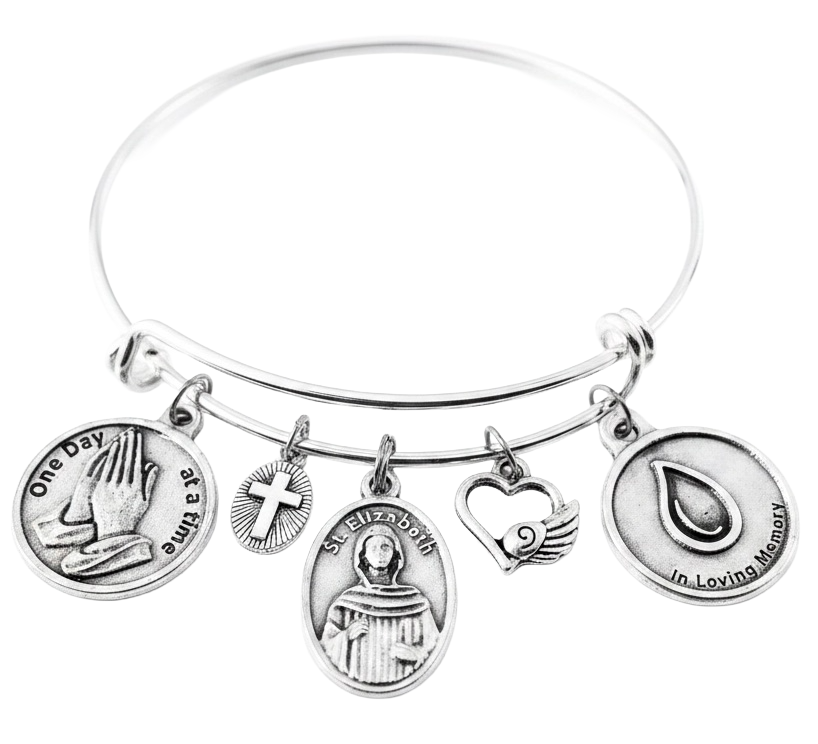 Silver expandable charm bangle bracelet featuring One Day at a Time praying hands, cross, Saint Elizabeth Ann Seton medal, angel wing heart, and In Loving Memory teardrop charms 