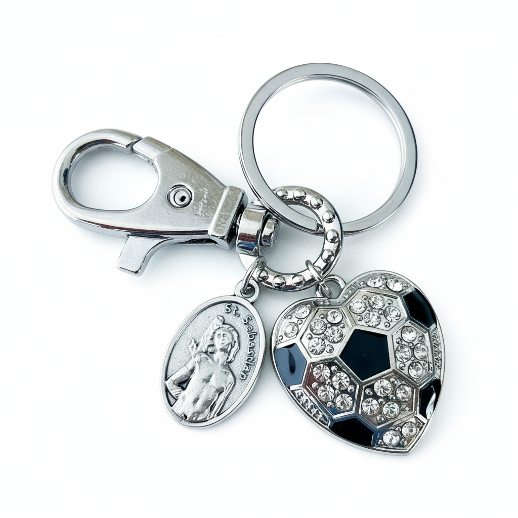 Saint Sebastian patron saint of sports keychain with heart-shaped soccer ball charm and rhinestones, silver-tone alloy"