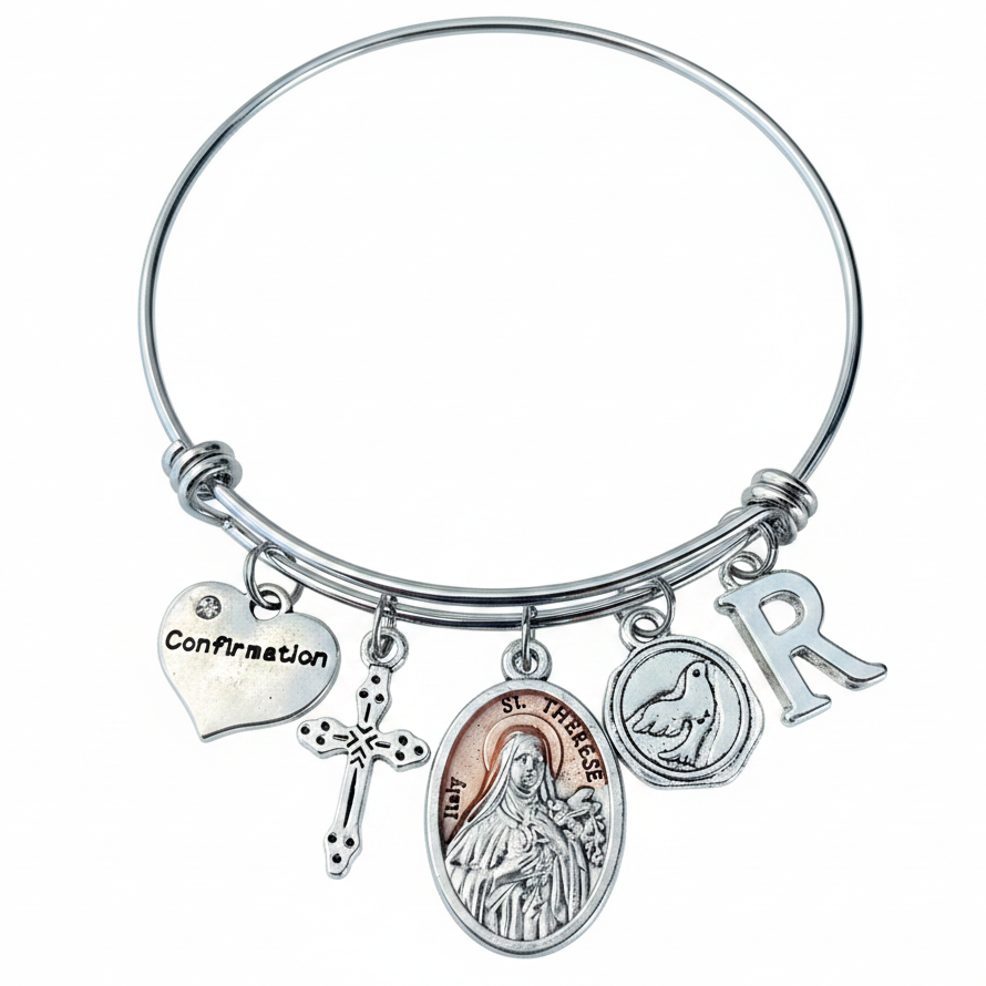 St. Therese of the Little Flower silver-plated saint medal on an adjustable stainless steel bangle with a Holy Spirit dove and personalized initial.