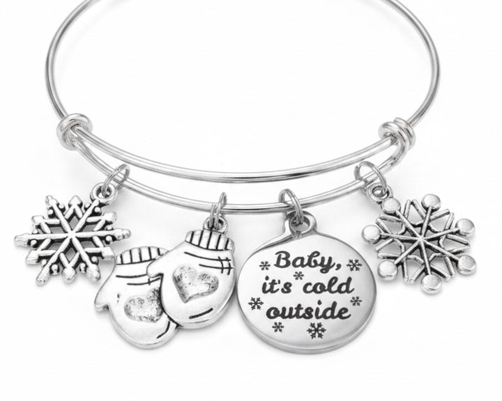 Silver expandable bangle with snowflake, mitten, and Baby It&