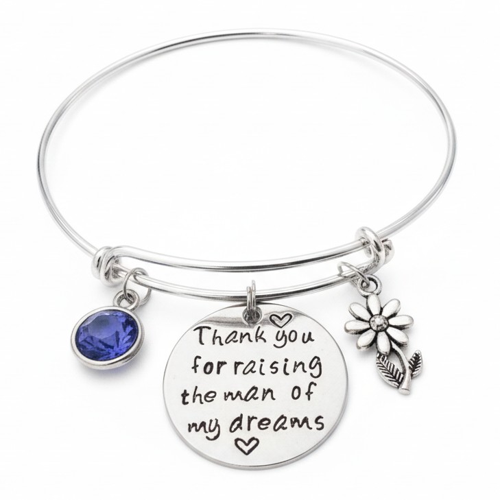 Silver expandable charm bangle bracelet with engraved disc reading Thank You for Raising the Man of My Dreams, blue sapphire crystal birthstone charm, and daisy flower charm — mother-in-law wedding gift by Jules Obsession
