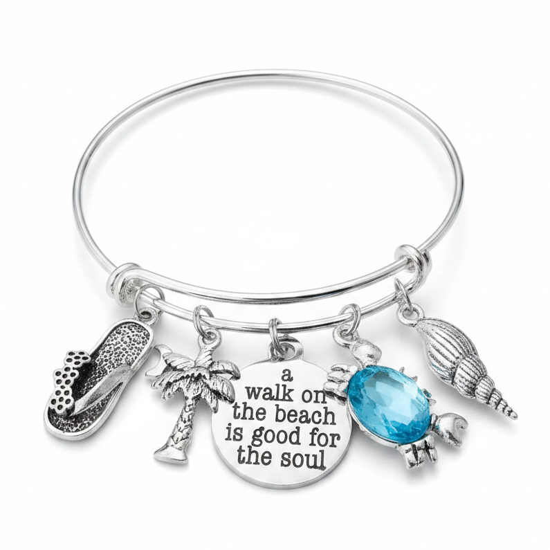 Silver expandable charm bangle with flip flop, palm tree, A Walk on the Beach is Good for the Soul engraved disc, aqua blue crab gemstone and seashell charms on white background – beach gift for women by Jules Obsession