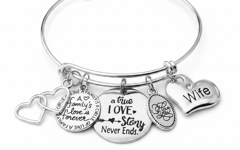 Silver expandable charm bracelet for wife featuring five charms: double interlocking hearts, A Family&