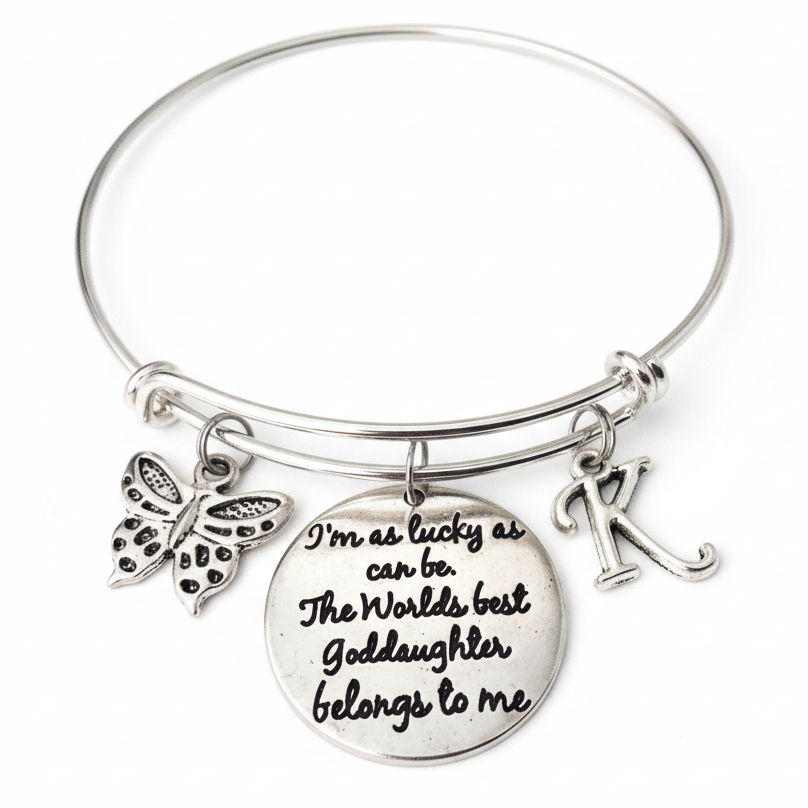 Silver expandable bangle bracelet with "World's Best Goddaughter" engraved quote disc, butterfly charm, and personalized initial charm – Goddaughter Baptism gift jewelry by Jules Obsession