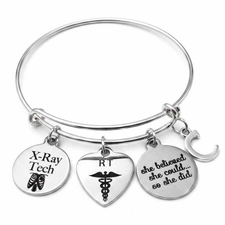 Personalized X-Ray Tech RT She Believed She Could charm bracelet with X-Ray Tech ribcage disc, RT heart caduceus disc, She Believed She Could engraved disc, and custom initial C charm — silver expandable bangle radiology graduation gift by Jules Obsession