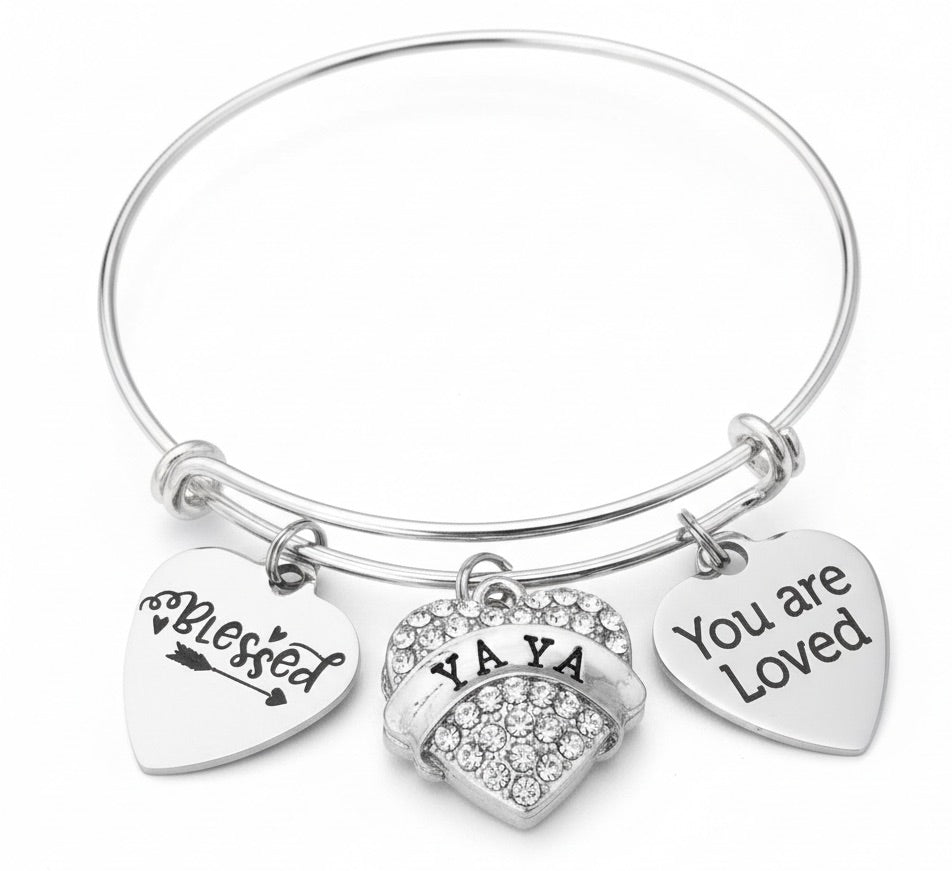 Silver bracelet with heart-shaped charms reading &