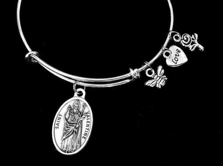 Silver expandable bangle bracelet with Saint Valentine oval Catholic saint medal, bee charm, love heart engraved charm, and rose charm 