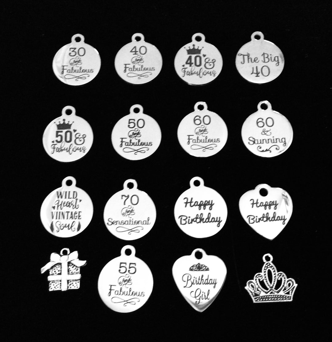 Numbered silver-plated birthday milestone charm collection for Jules Obsession expandable bangle bracelets including 30 & Fabulous, 40 & Fabulous, 40 & Fabulous with Crown, The Big 40, 50 & Fabulous with Crown, 50 Fabulous, 60 Fabulous, 60 & Stunning, Wild Heart Vintage Soul, 70 Sensational, Happy Birthday round disc, Happy Birthday heart, gift box bow charm, 55 & Fabulous, Birthday Girl heart, and Princess Crown tiara charm in antique silver tone