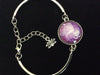 Purple Tree of Life Glass Domed Charm and Silver Lotus Charm on a Silver Adjustable Cuff Bracelet 