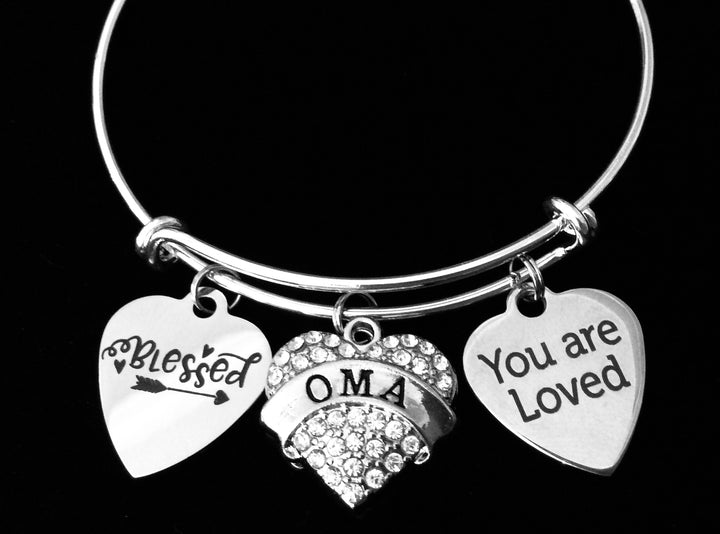 Expandable silver charm bracelet with “You Are Loved,” “Blessed,” and crystal heart charms for Oma