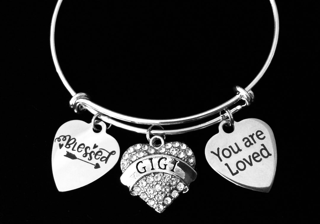 Silver expandable charm bracelet with “You Are Loved,” “Blessed,” and crystal heart charms for Gigi

