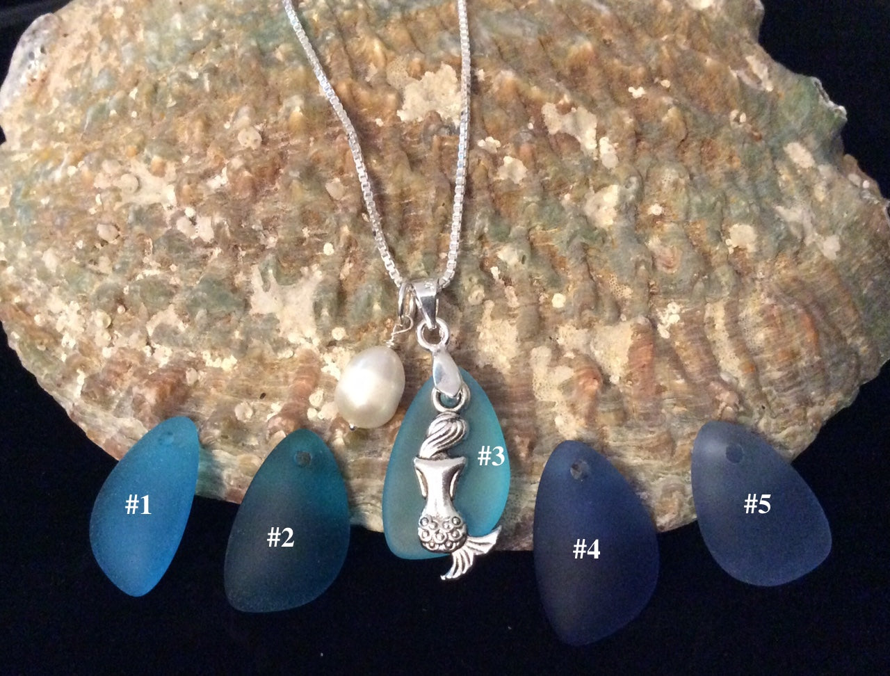 Mid Blue sea glass necklace pendant on sterling silver chain.